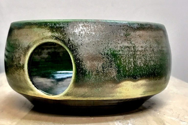 Two ceramic test tiles and one bowl showcasing sustainable glazes. The tiles display beautiful subtle colors of blue, green, and gray